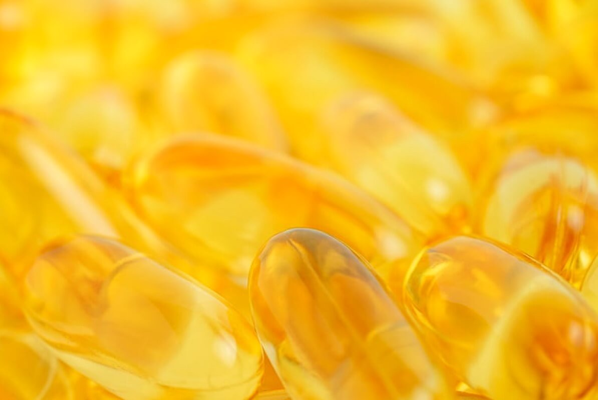 Omega-3 fish oil softgels, macro studio photo